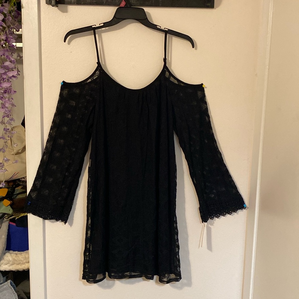 Large black off-shoulder dress, with mesh bell sleeves.